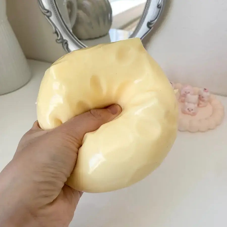 2026 New Moldable Cheese Stress Toy – Soft, squishy, and fun to squeeze. This giant yellow ASMR pressure ball helps relieve stress while keeping your hands busy. Perfect for relaxing, fidgeting, and sensory play.